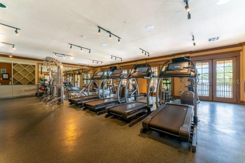 89 Vivante Boulevard, Unit 8942 Punta Gorda, FL 33950 - Photo 36 of 44 a gym room with lots of gym equipment