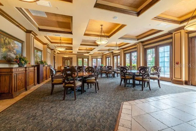 a view of a dining room with furniture window and outside view