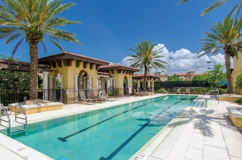 89 Vivante Boulevard, Unit 8942 Punta Gorda, FL 33950 - Photo 4 of 44 a view of a house with swimming pool and porch with furniture