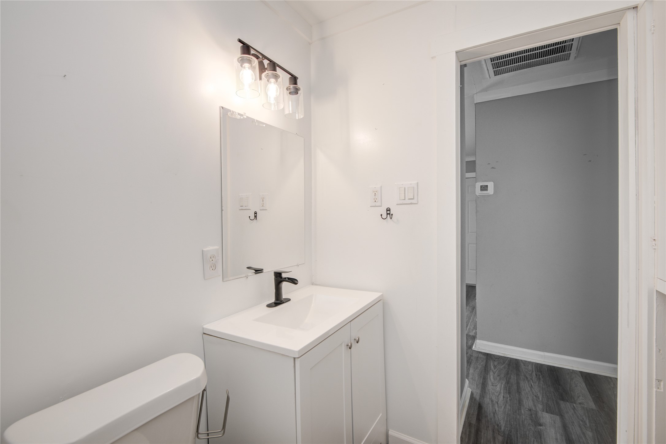 609 Hurst Place Angleton, TX 77515 - Photo 24 of 36 a bathroom with a sink a toilet and shower