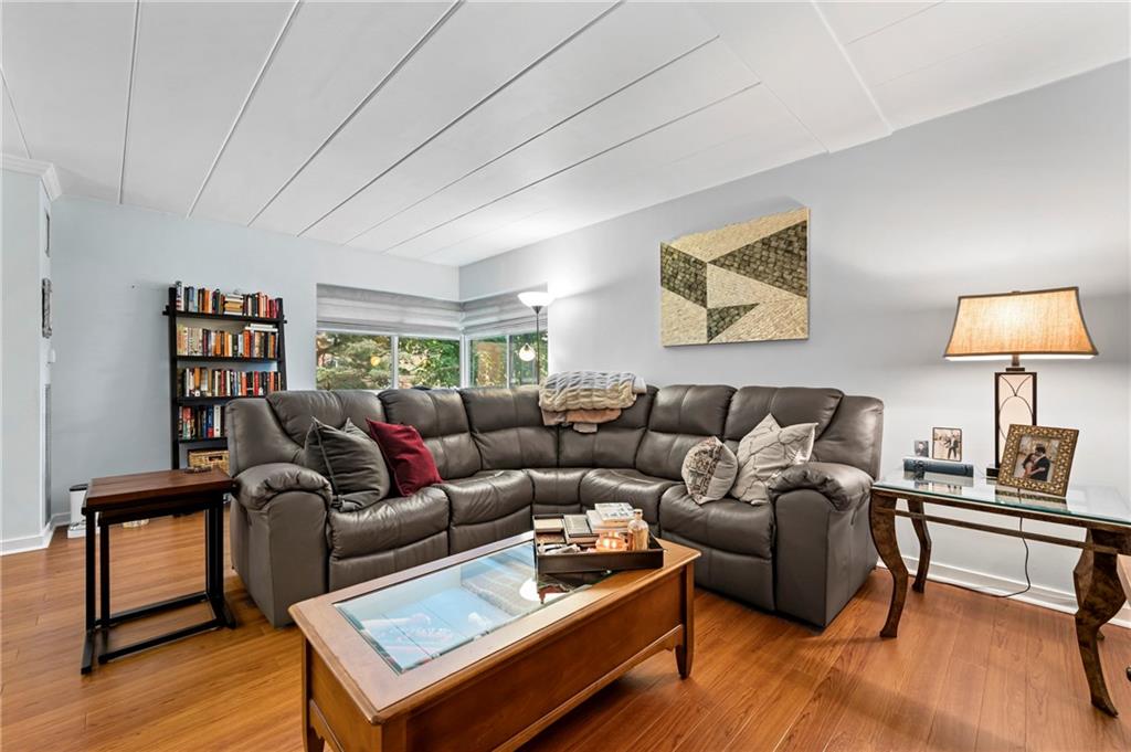 5 Bayard Road, Unit 203 Pittsburgh, PA 15213 - Photo 11 of 21 a living room with furniture and a wooden floor