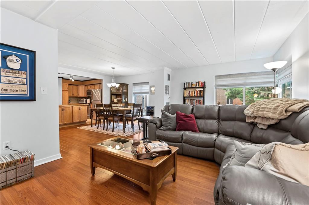 5 Bayard Road, Unit 203 Pittsburgh, PA 15213 - Photo 12 of 21 a living room with furniture wooden floor and a large window