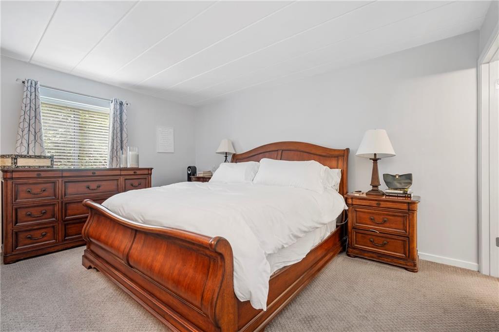 5 Bayard Road, Unit 203 Pittsburgh, PA 15213 - Photo 13 of 21 a bed sitting in a bedroom and dresser