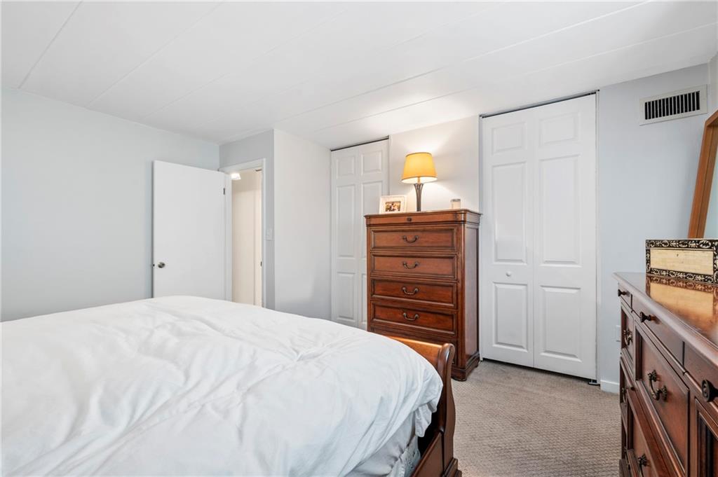 5 Bayard Road, Unit 203 Pittsburgh, PA 15213 - Photo 14 of 21 a bedroom with a bed and a closet