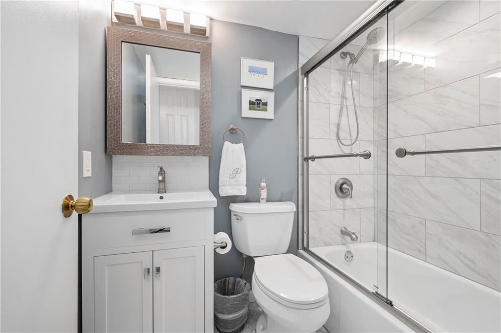 5 Bayard Road, Unit 203 Pittsburgh, PA 15213 - Photo 15 of 21 a bathroom with a sink a toilet and shower