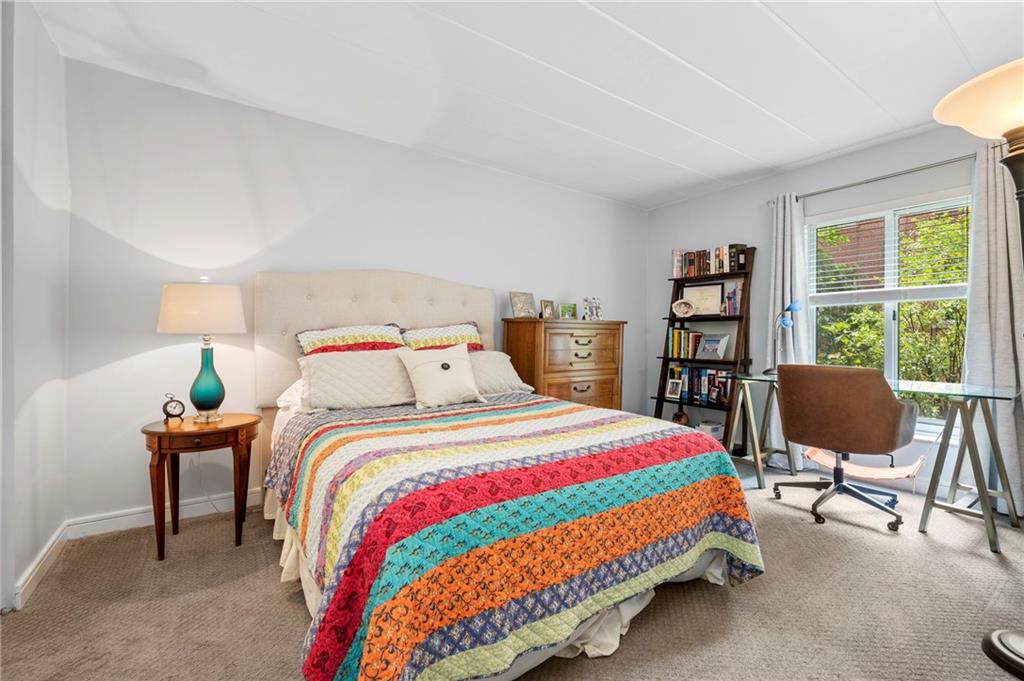 5 Bayard Road, Unit 203 Pittsburgh, PA 15213 - Photo 16 of 21 a bedroom with a bed and a chair