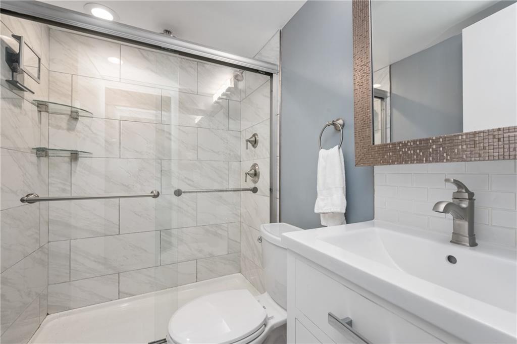 5 Bayard Road, Unit 203 Pittsburgh, PA 15213 - Photo 17 of 21 a bathroom with a sink toilet and shower