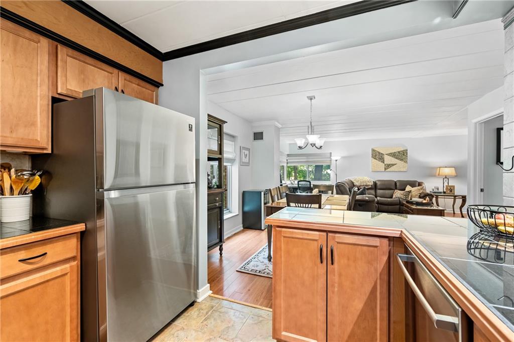 5 Bayard Road, Unit 203 Pittsburgh, PA 15213 - Photo 6 of 21 a kitchen with a refrigerator a stove and a sink