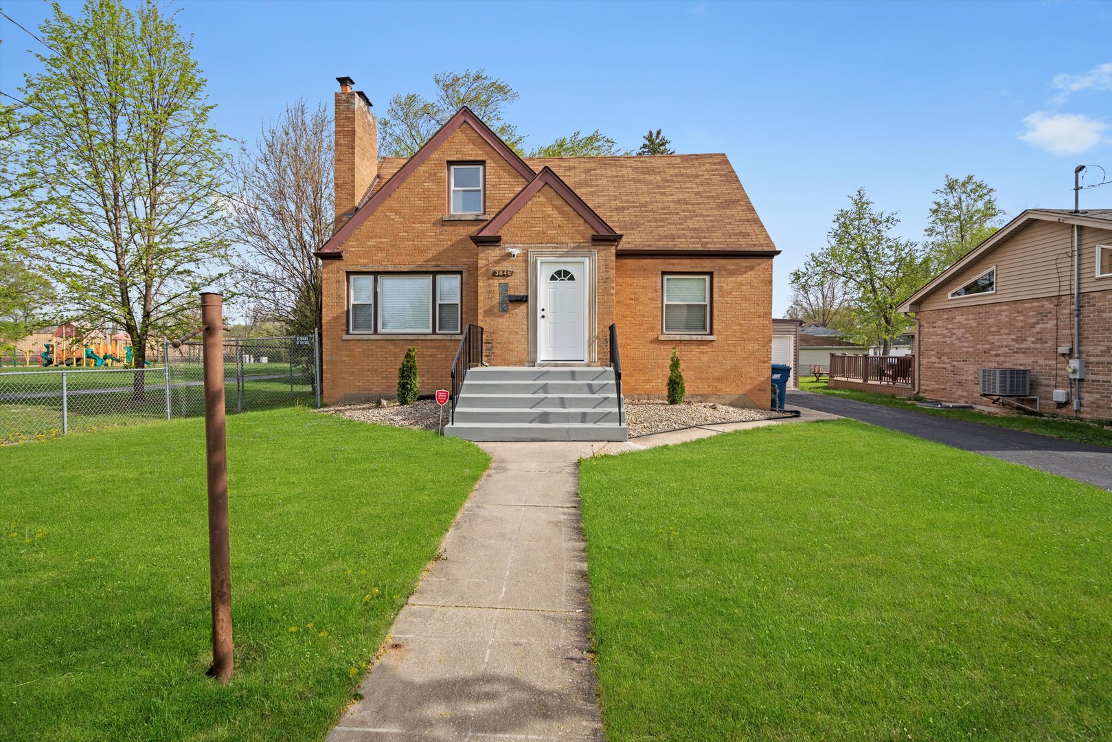 3846 149th Street Midlothian, IL 60445 - Photo 1 of 13 a front view of a house with a yard