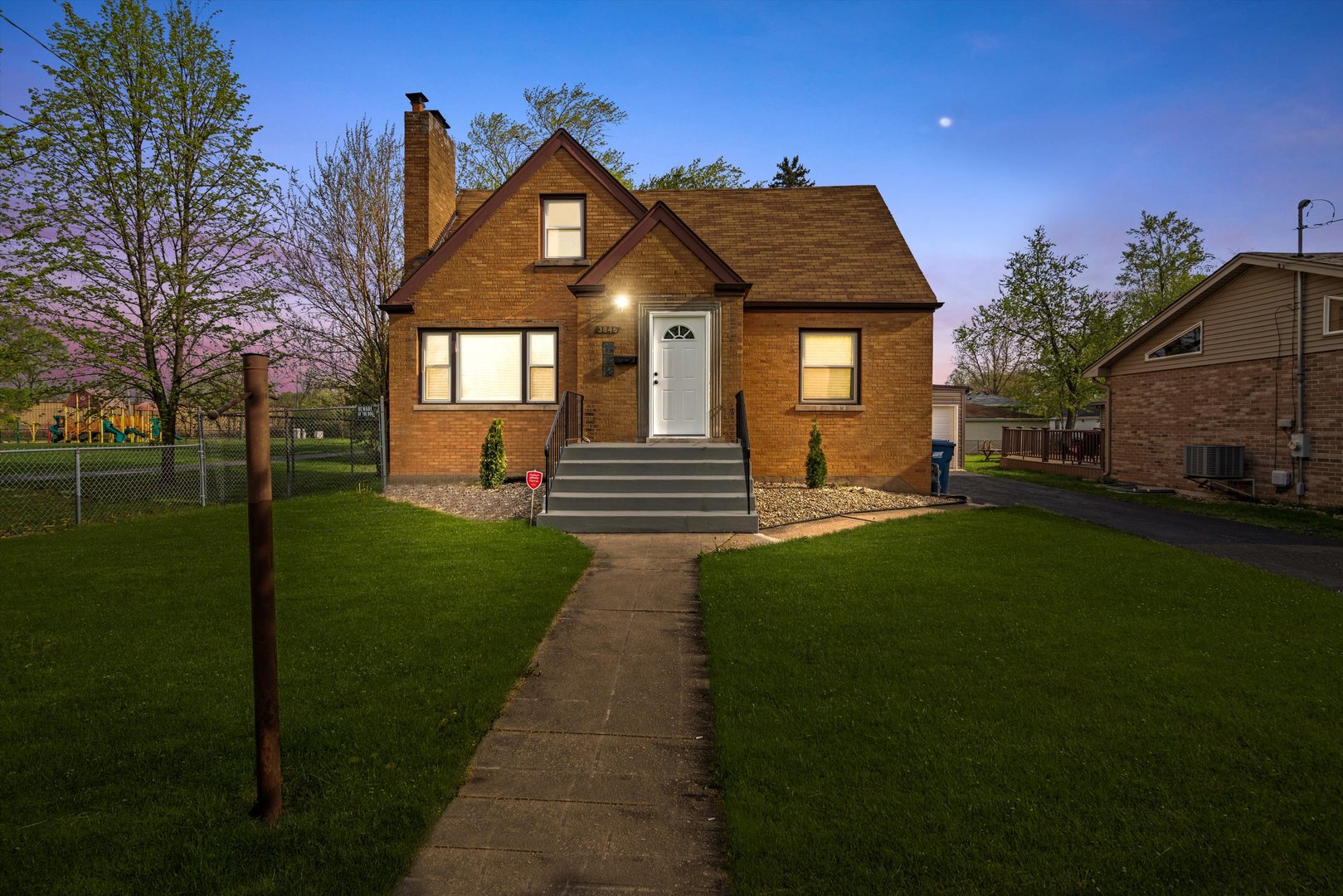 3846 149th Street Midlothian, IL 60445 - Photo 2 of 13 a front view of a house with a yard