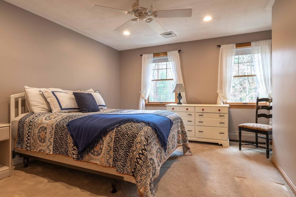 70 Birch Hill Road Northampton, MA 01062 - Photo 18 of 30 a bedroom with a bed and a chair