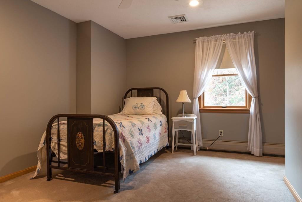 70 Birch Hill Road Northampton, MA 01062 - Photo 19 of 30 a bedroom with a bed and a window