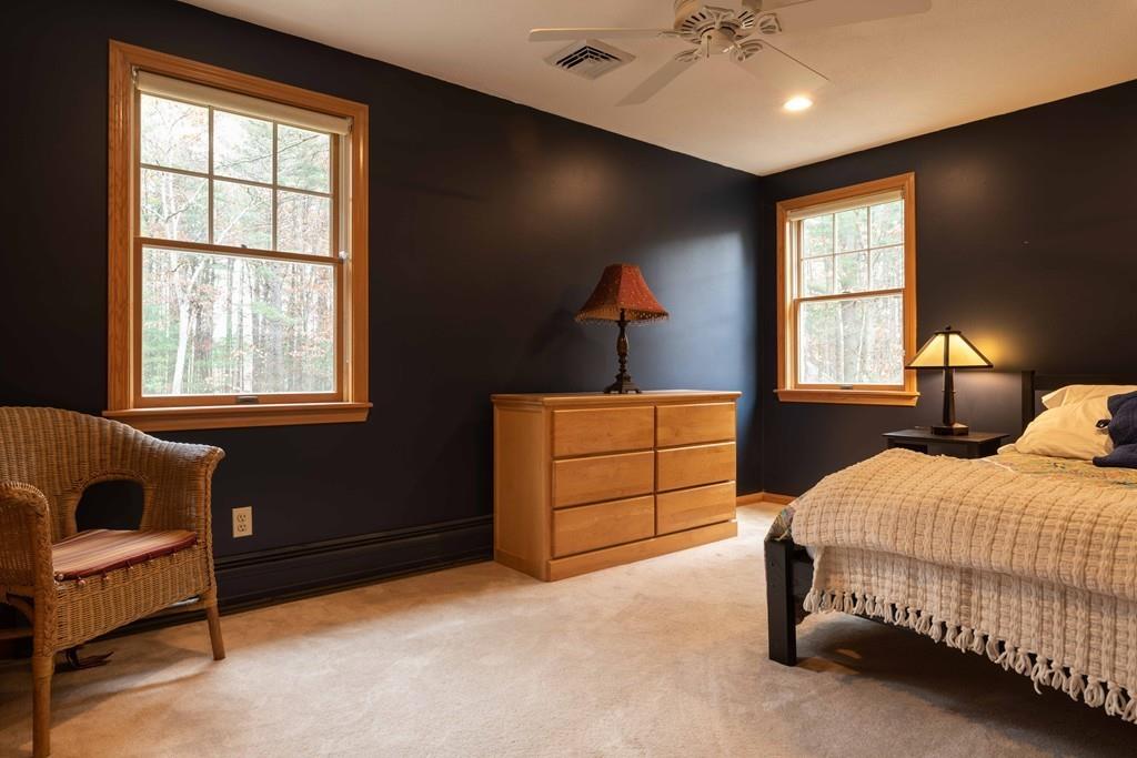 70 Birch Hill Road Northampton, MA 01062 - Photo 20 of 30 a bedroom with a bed and a dresser next to a window
