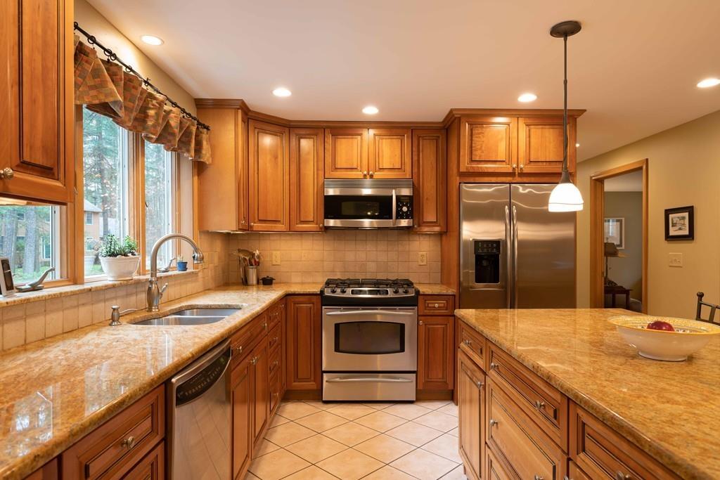 70 Birch Hill Road Northampton, MA 01062 - Photo 5 of 30 a kitchen with stainless steel appliances granite countertop a sink a stove and a refrigerator