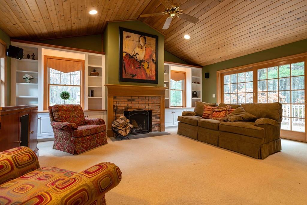 70 Birch Hill Road Northampton, MA 01062 - Photo 8 of 30 a living room with furniture a fireplace and a large window