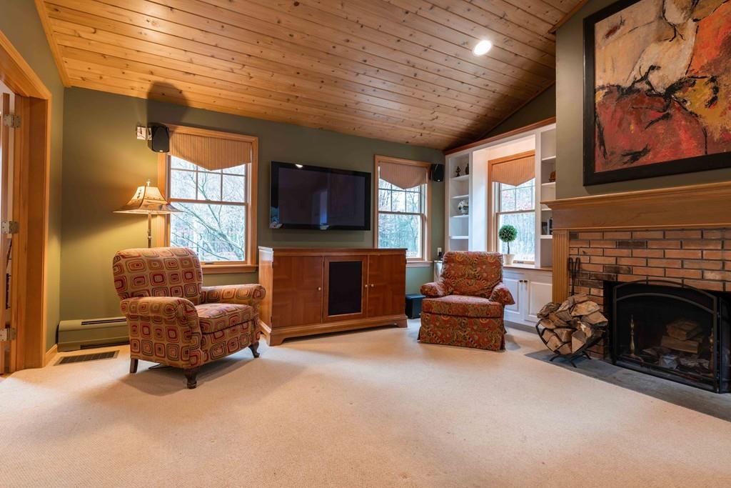 70 Birch Hill Road Northampton, MA 01062 - Photo 9 of 30 a living room with furniture and a fireplace
