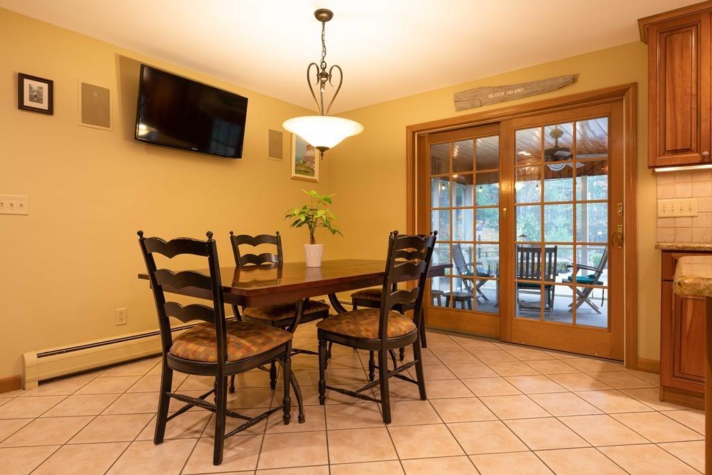 70 Birch Hill Road Northampton, MA 01062 - Photo 10 of 30 a view of a dining room with furniture and a flat screen tv