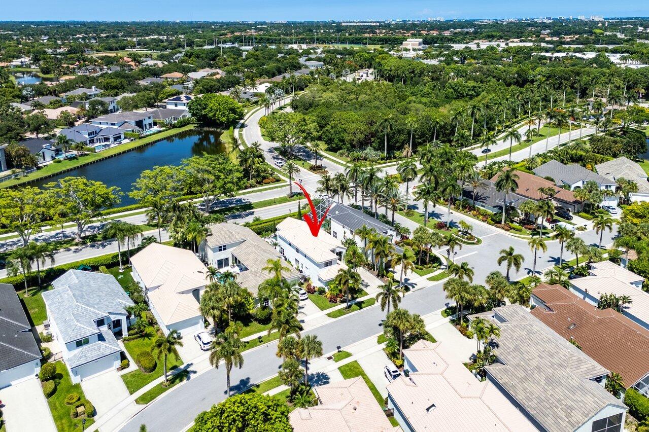 3395 Northwest 53rd Circle Boca Raton, FL 33496 - Photo 28 of 64 an aerial view of residential houses with outdoor space and trees