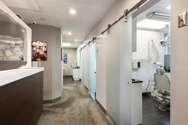 a bathroom with a sink mirror and a shower