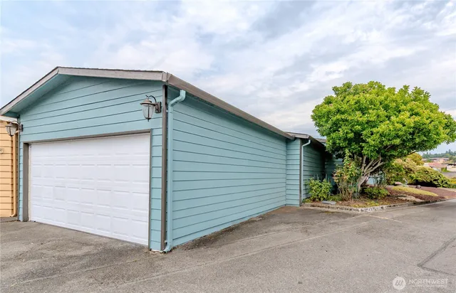 a view of a garden with a house