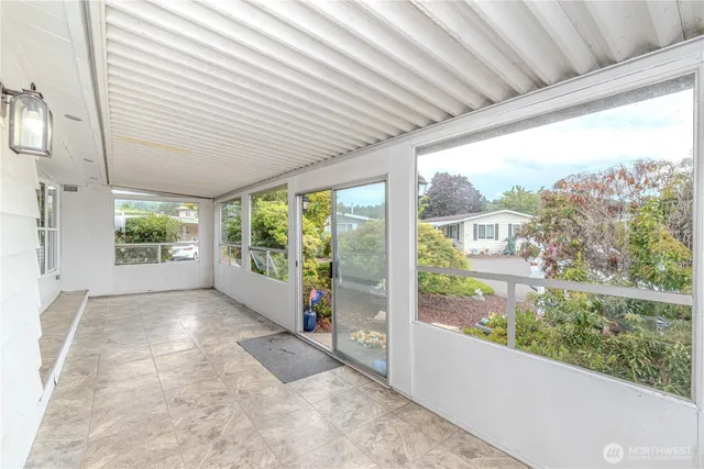 a view of a porch with a large window