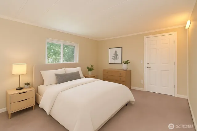 a large white bed in a white room