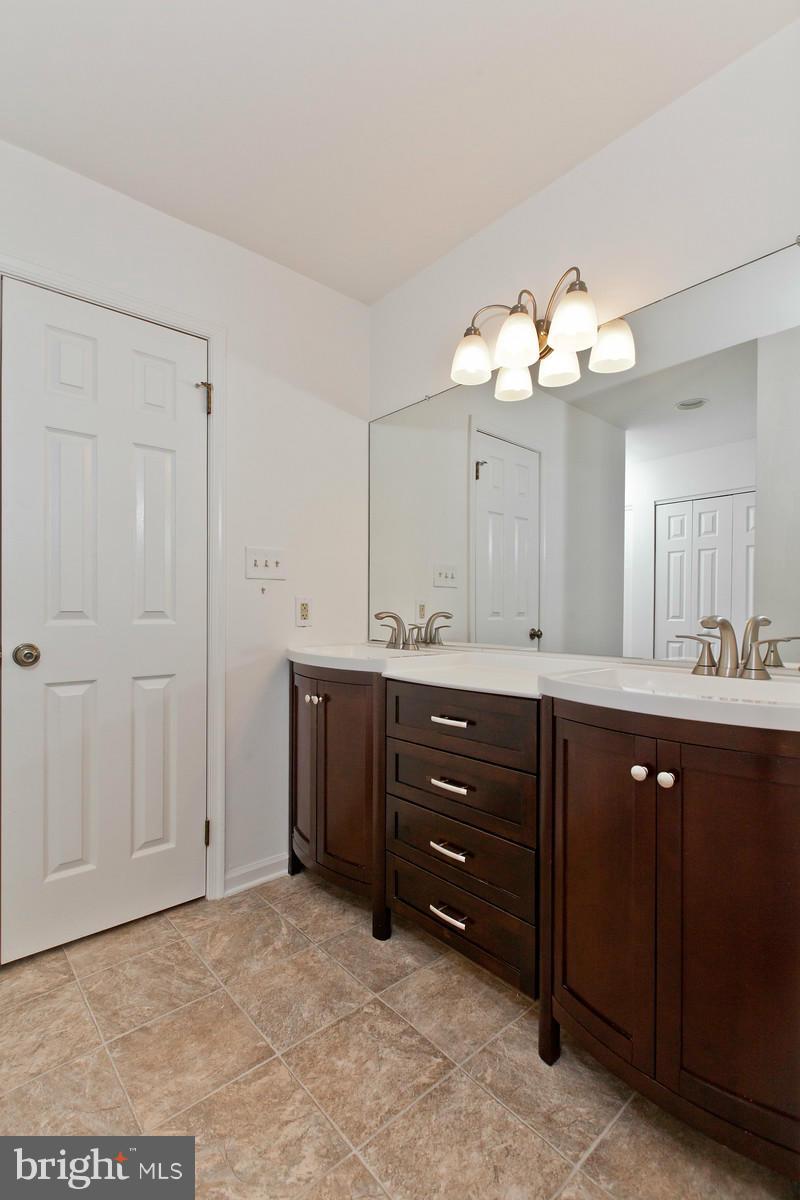 3880 Point Of Rocks Road Jefferson, MD 21755 - Photo 15 of 30 a view of a double vanity sink and a mirror