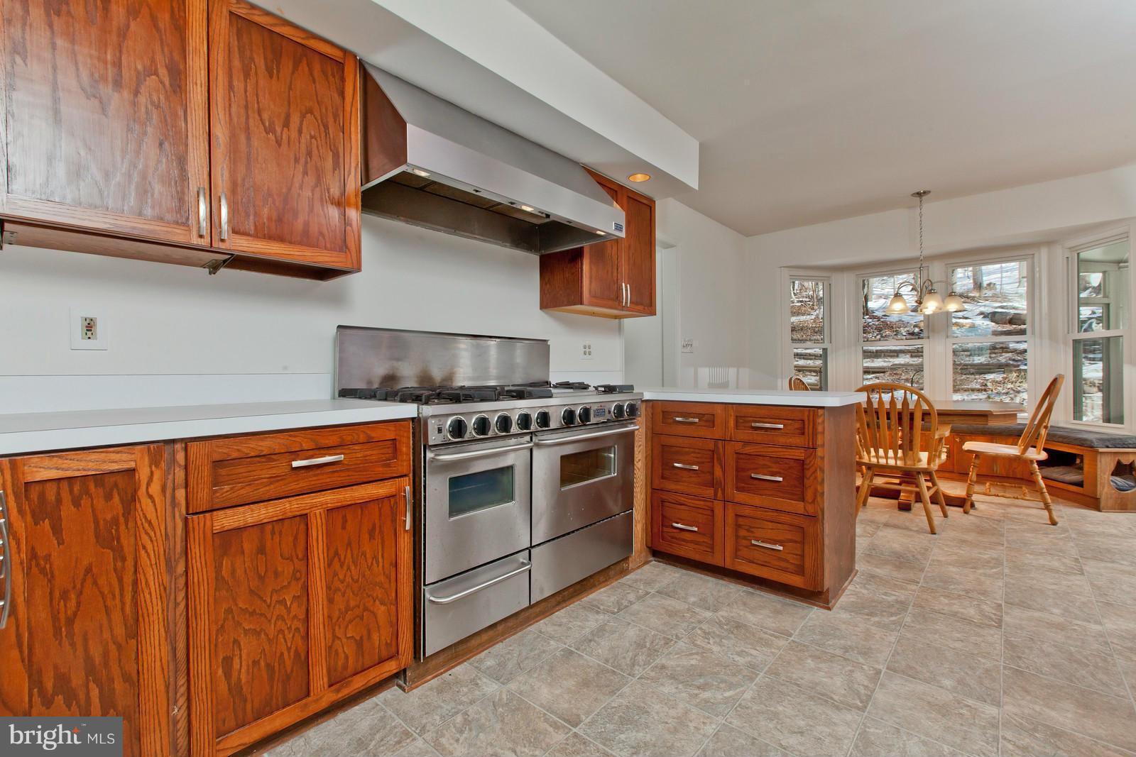 3880 Point Of Rocks Road Jefferson, MD 21755 - Photo 8 of 30 a kitchen with stainless steel appliances granite countertop a stove a sink and a refrigerator