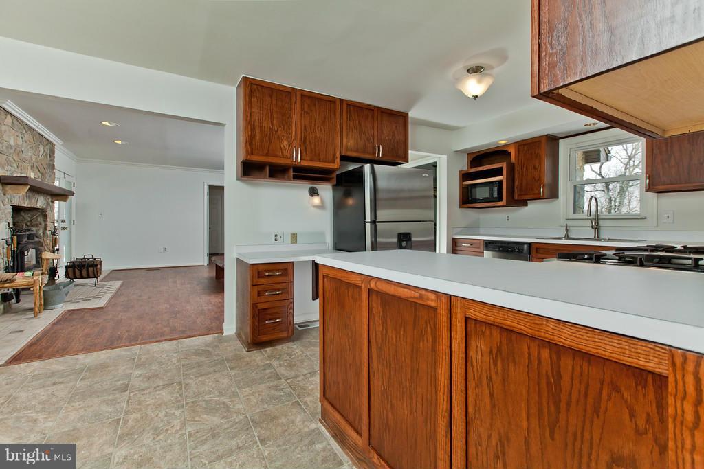 3880 Point Of Rocks Road Jefferson, MD 21755 - Photo 9 of 30 a kitchen with stainless steel appliances granite countertop a refrigerator and a stove