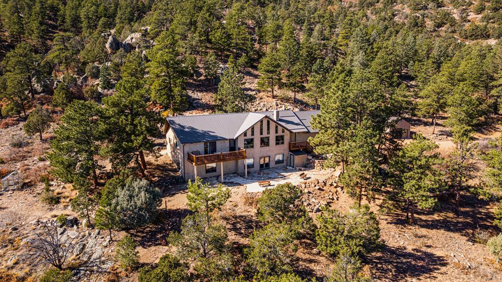1301 Pheasant Loop Westcliffe, CO 81252 - Photo 1 of 27 an aerial view of a house with a yard