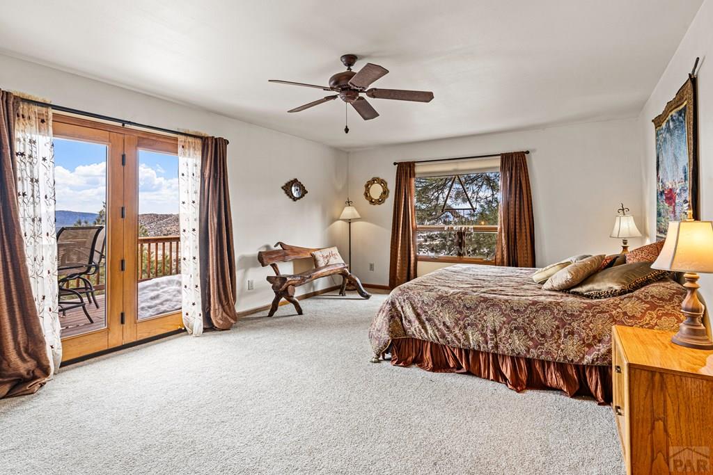1301 Pheasant Loop Westcliffe, CO 81252 - Photo 11 of 27 a bedroom with two beds and a large window