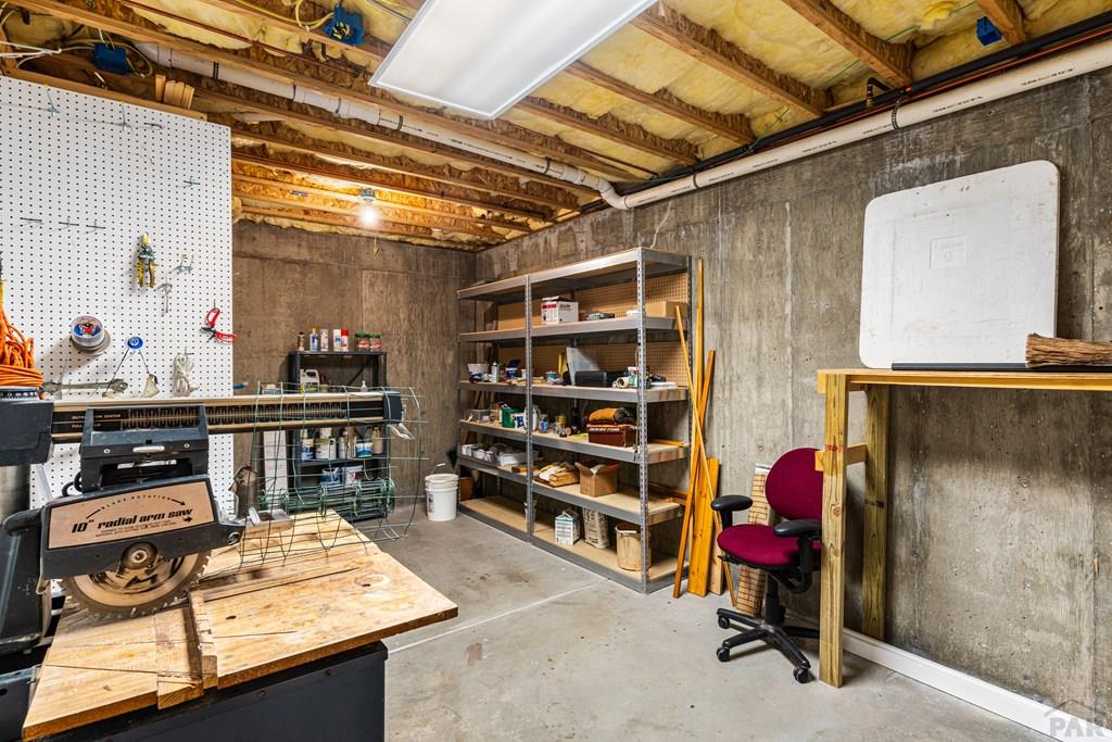 1301 Pheasant Loop Westcliffe, CO 81252 - Photo 23 of 27 a storage room with wooden shelves