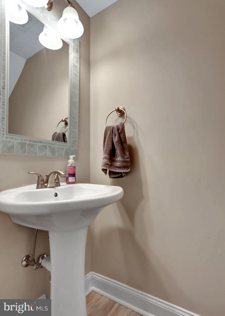 577 Lancaster Place Frederick, MD 21703 - Photo 4 of 19 a bathroom with a sink and mirror