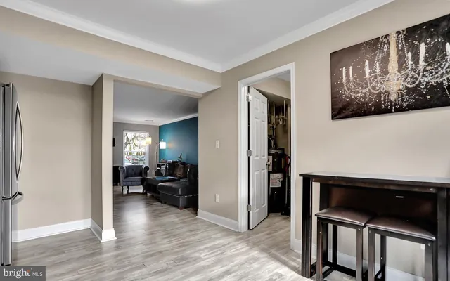 a view of a livingroom with furniture and workspace