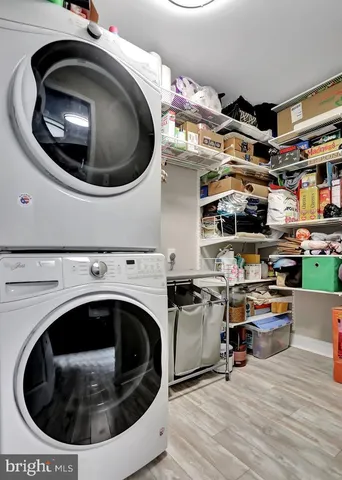 a utility room with sink dryer and washer