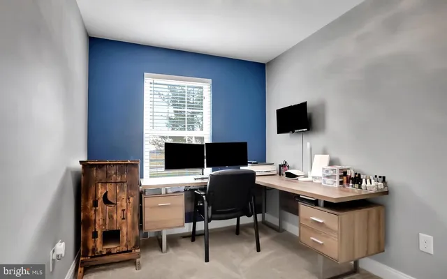 a view of a workspace with furniture