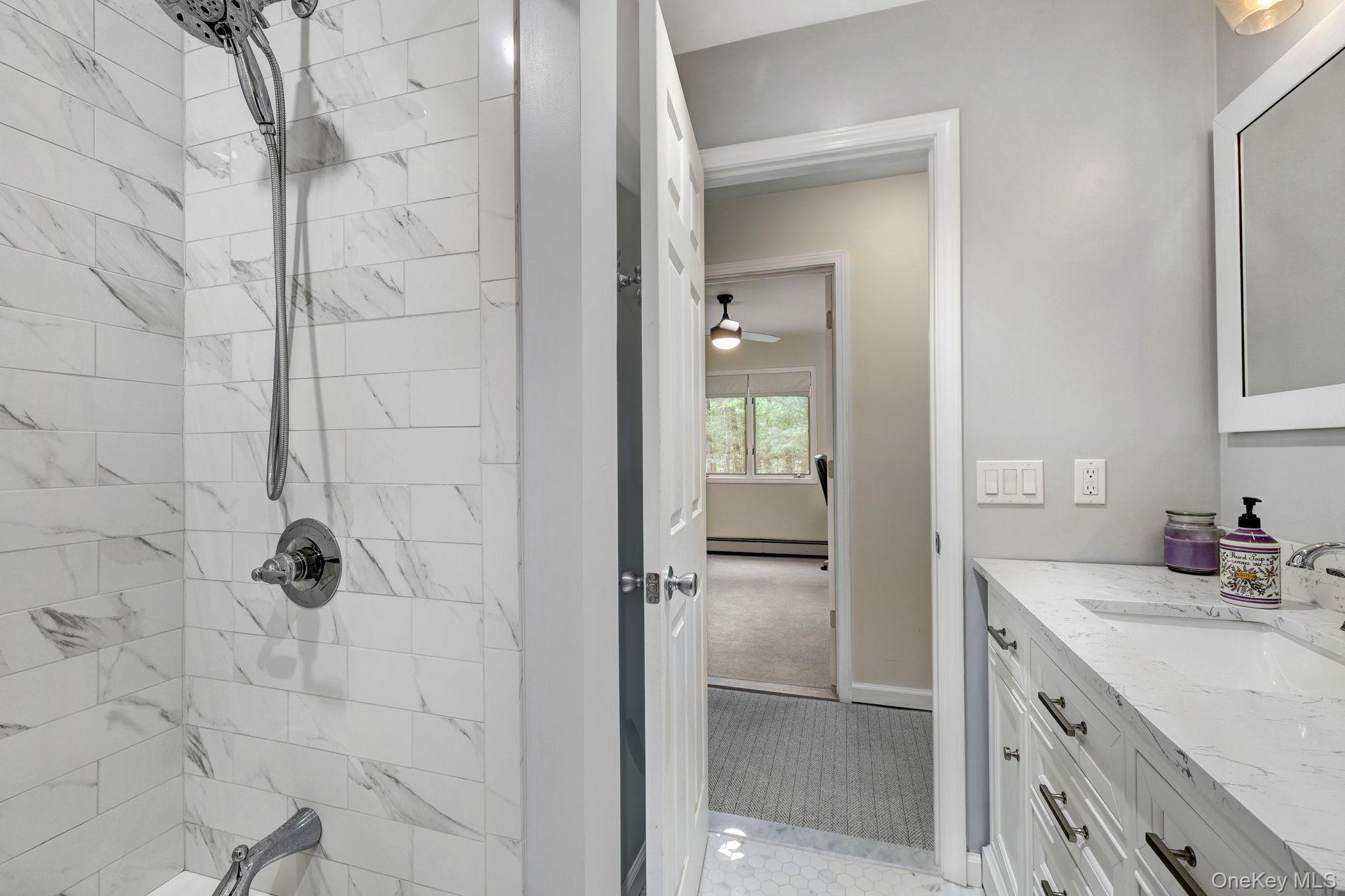 90 M And M Road Middletown, NY 10940 - Photo 13 of 50 a bathroom with a granite countertop sink a mirror and shower
