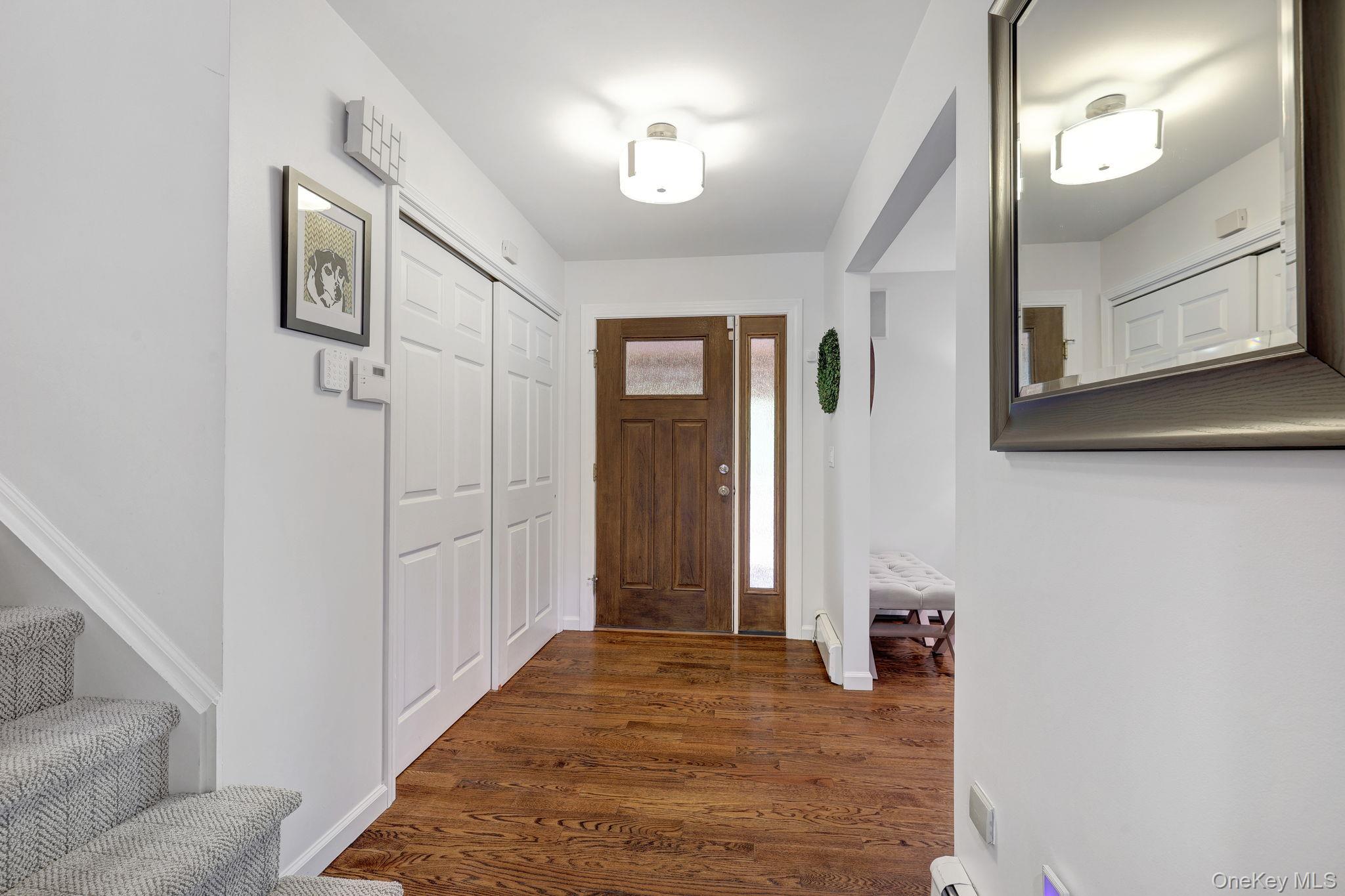 90 M And M Road Middletown, NY 10940 - Photo 14 of 50 a view of livingroom with hardwood floor and hallway