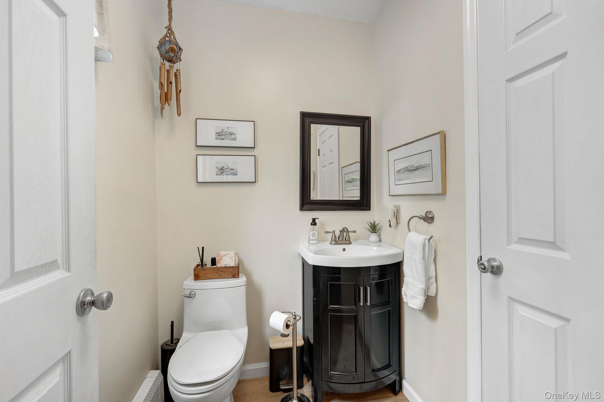 90 M And M Road Middletown, NY 10940 - Photo 19 of 50 a bathroom with a toilet a sink and mirror