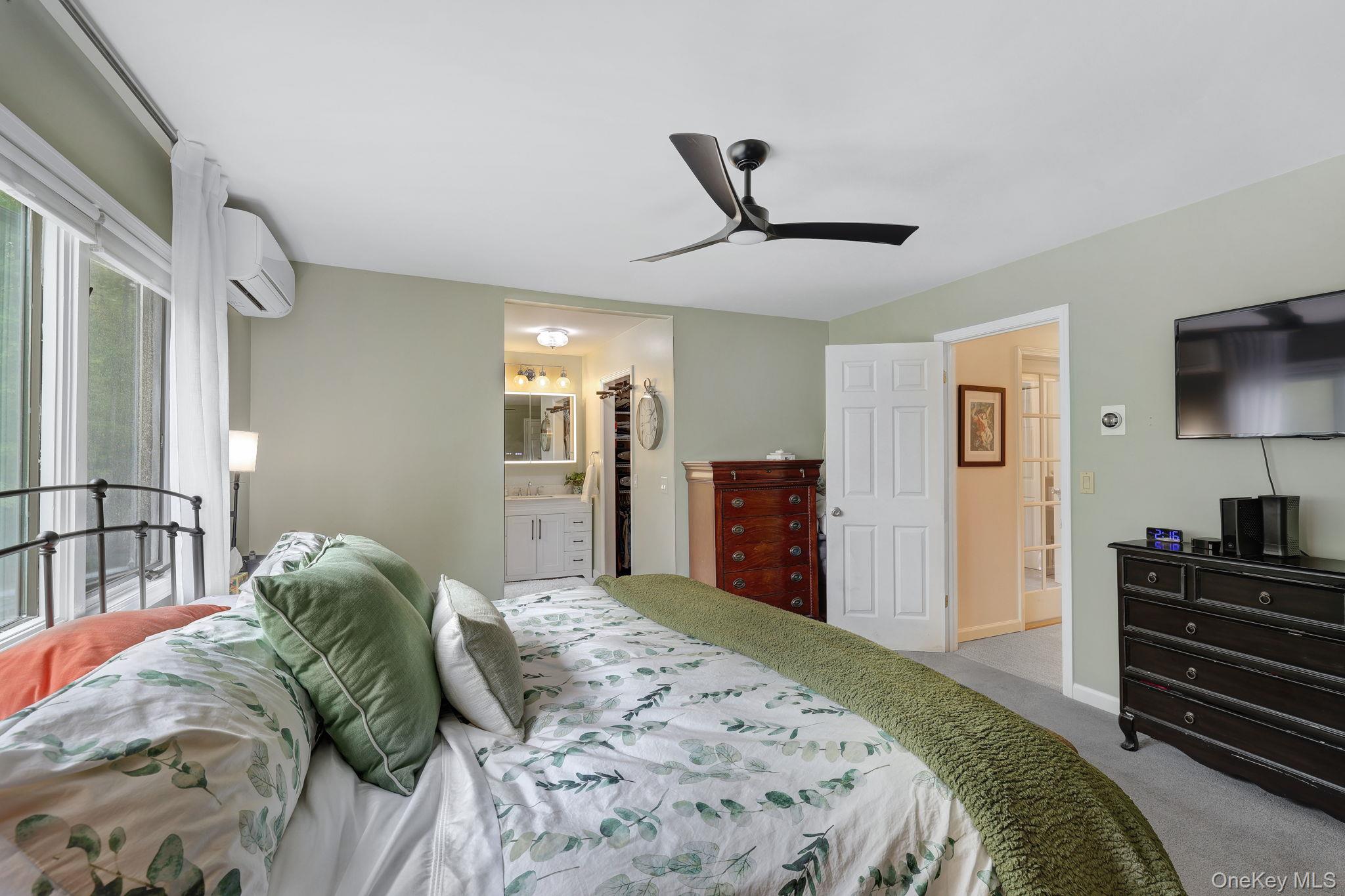 90 M And M Road Middletown, NY 10940 - Photo 24 of 50 a spacious bedroom with a bed and a flat screen tv