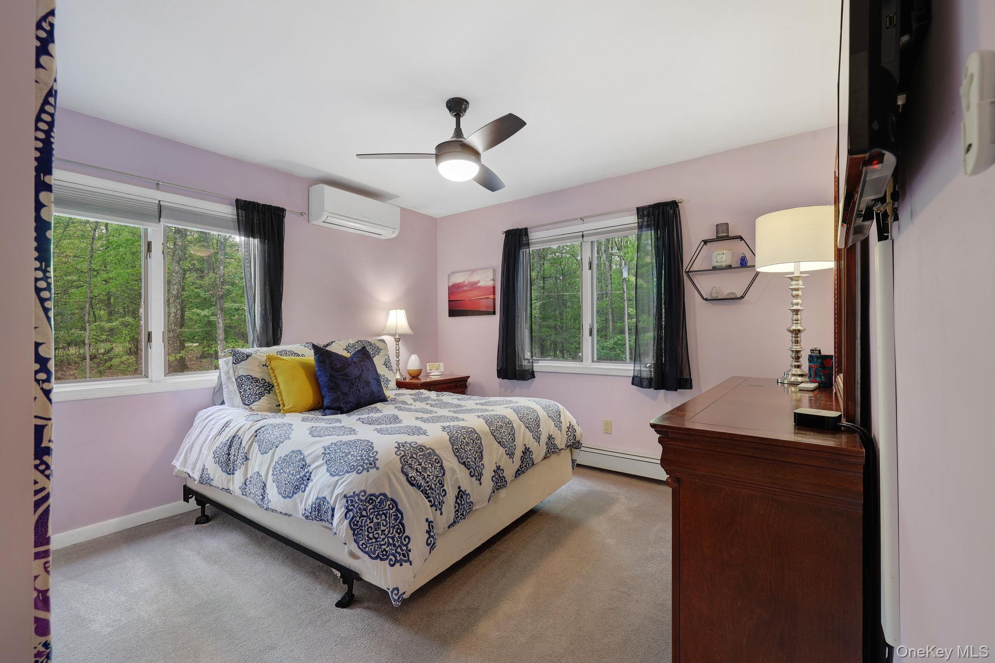 90 M And M Road Middletown, NY 10940 - Photo 30 of 50 a bedroom with a bed and large windows