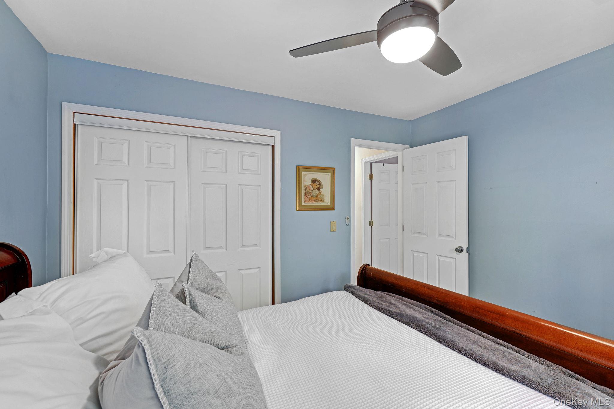 90 M And M Road Middletown, NY 10940 - Photo 33 of 50 a bedroom with a bed and a chandelier
