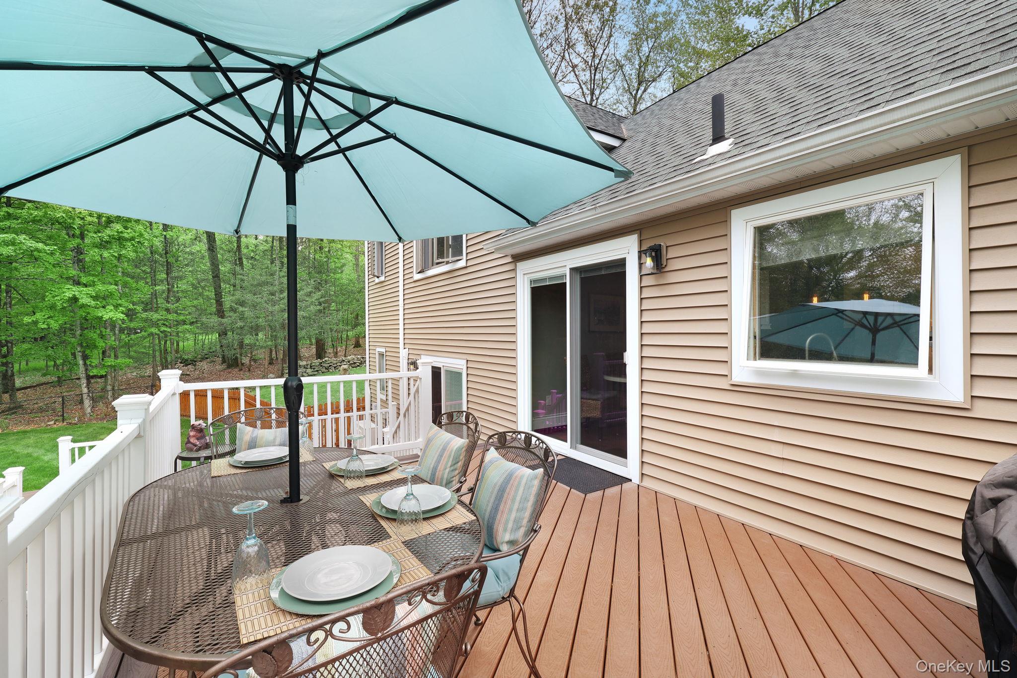 90 M And M Road Middletown, NY 10940 - Photo 34 of 50 a patio with wooden floor and outdoor seating