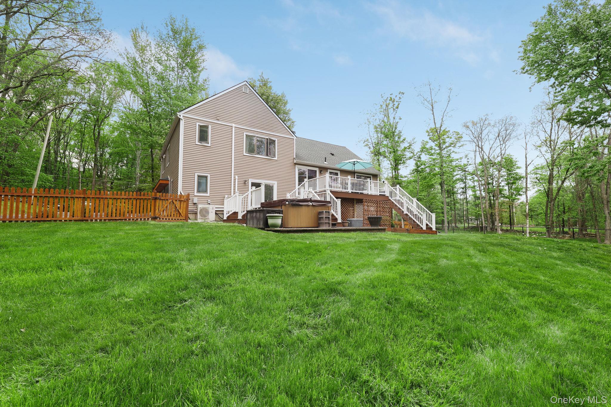 90 M And M Road Middletown, NY 10940 - Photo 39 of 50 a front view of a house with a yard and trees