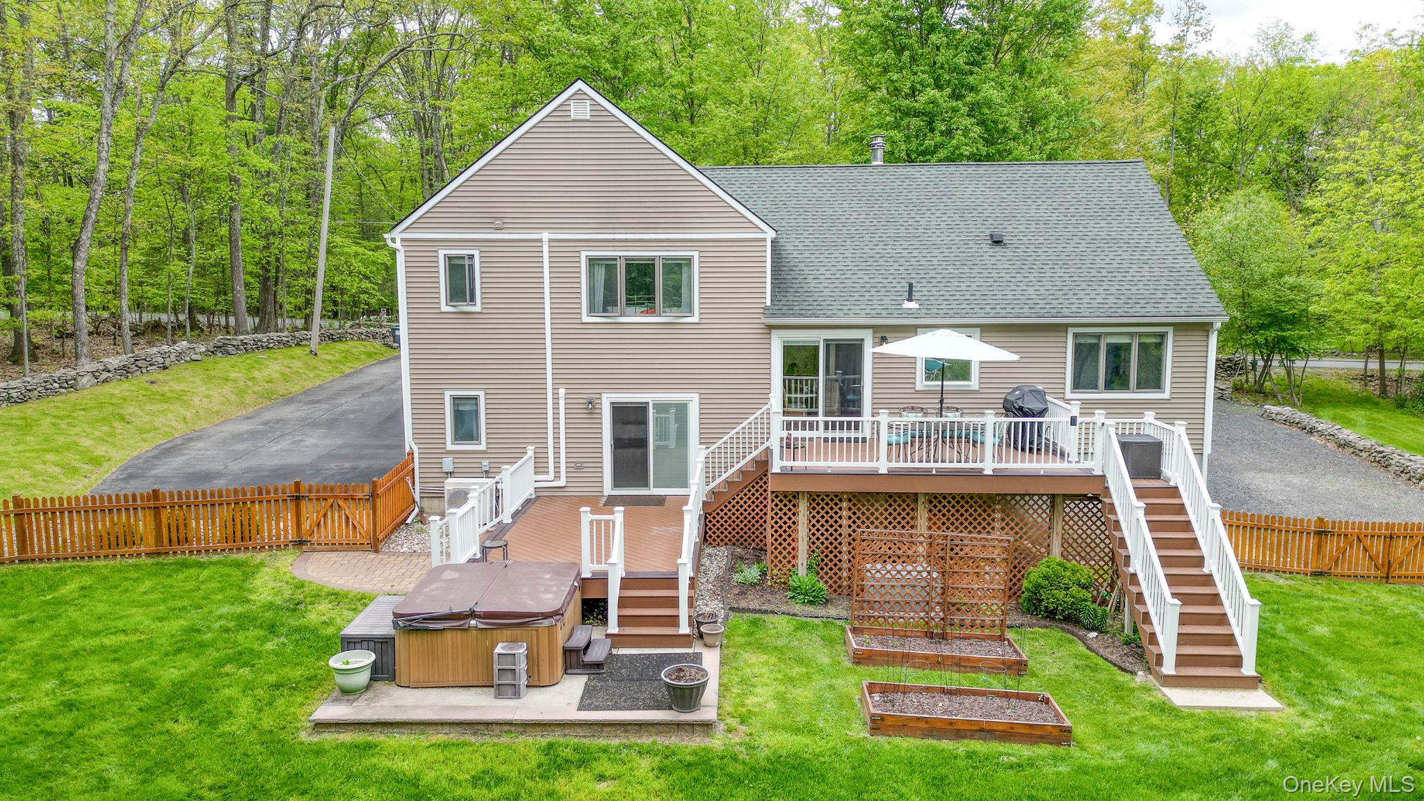 90 M And M Road Middletown, NY 10940 - Photo 4 of 50 a front view of house with a garden and patio