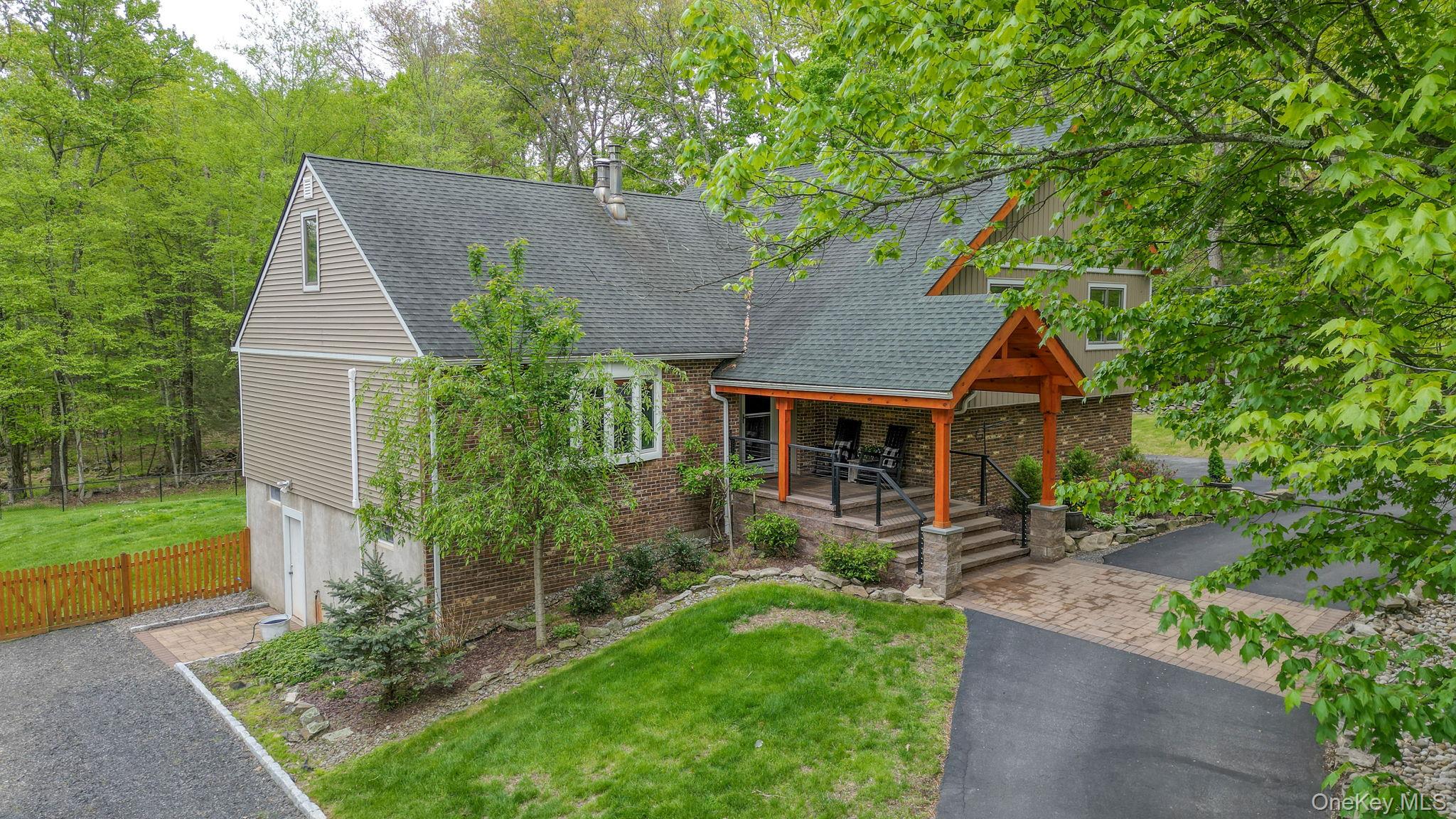 90 M And M Road Middletown, NY 10940 - Photo 45 of 50 a front view of a house with garden