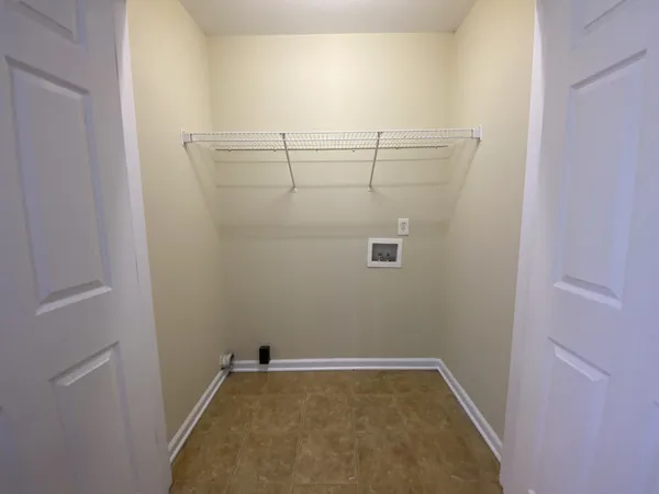a view of a room with racks on the wall
