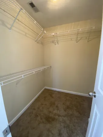 a view of a room with racks on the wall
