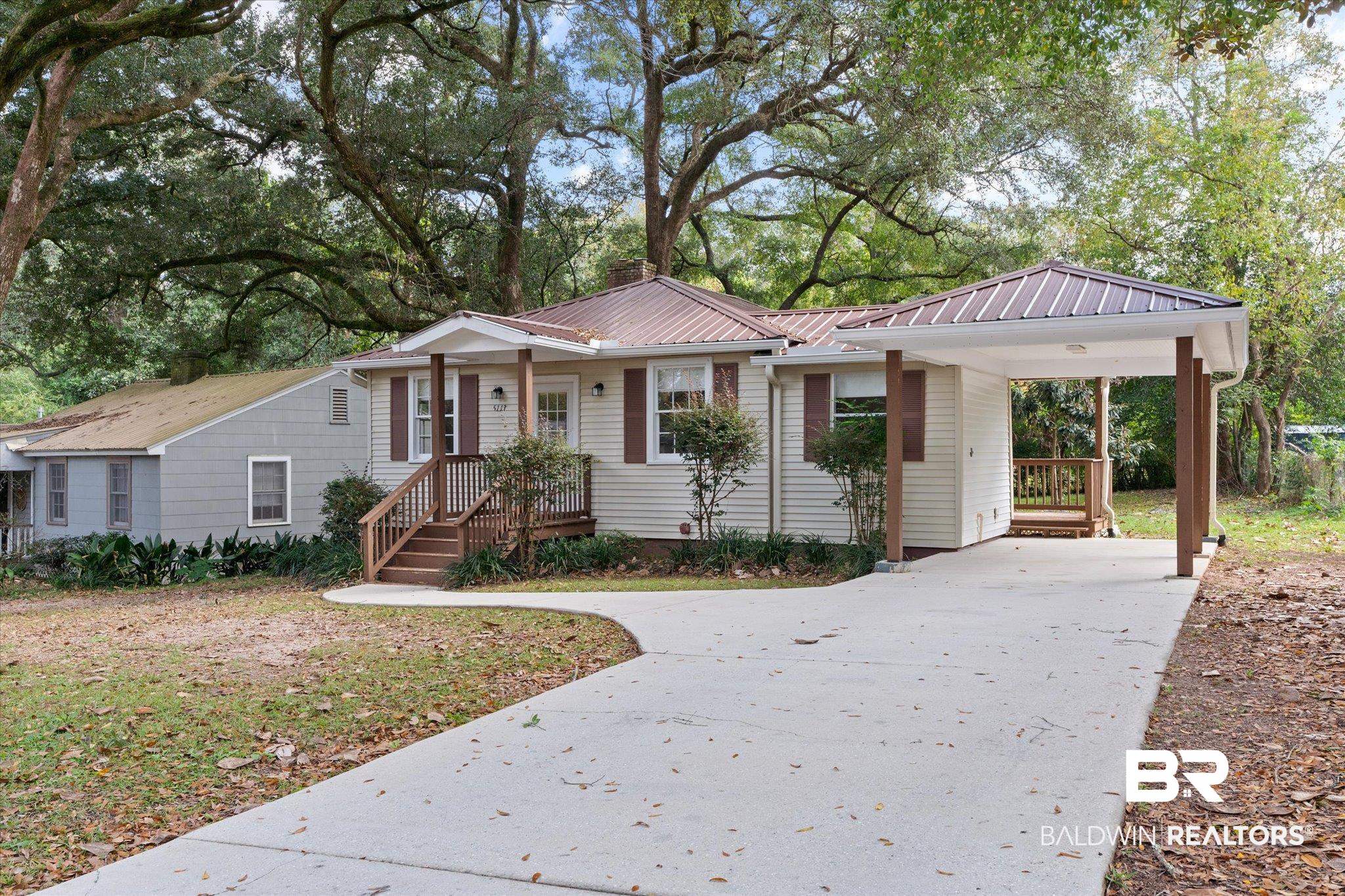 5113 Norton Lane Mobile, AL 36608 - Photo 19 of 20 View of front of house featuring a carport