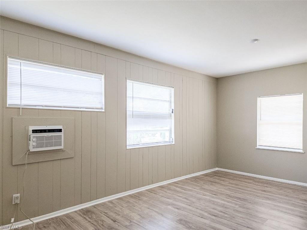 3488 Roberts Street Mims, FL 32754 - Photo 13 of 15 a view of an empty room with wooden floor and a window